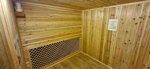 a small wooden sauna with a sign on it at Elegance hotel hwangridan in Gyeongju