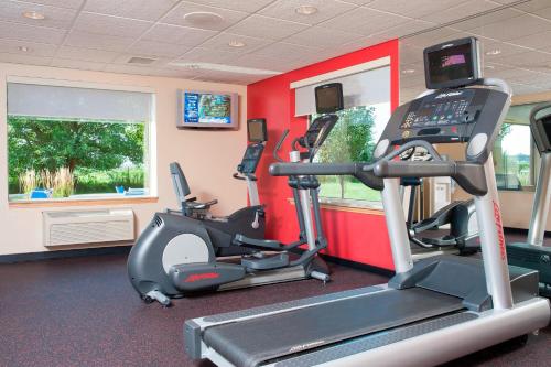 a gym with two tread machines and a treadmill at TownePlace Suites Des Moines Urbandale in Johnston