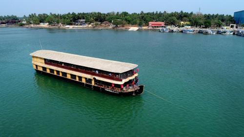 a pier in the middle of a large body of water at Thirumala Cruise in Udupi