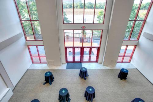 an overhead view of a room with tables and windows at SpringHill Suites by Marriott Lawrence Downtown in Lawrence