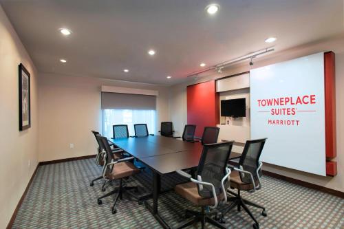 an office with a conference room with a table and chairs at TownePlace Suites by Marriott Des Moines West/Jordan Creek in West Des Moines