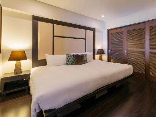 Postel nebo postele na pokoji v ubytování Kafuu Resort Fuchaku Condo Hotel