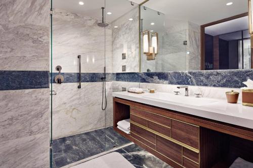 a bathroom with a sink and a shower at JW Marriott Hotel Monterrey Valle in Monterrey