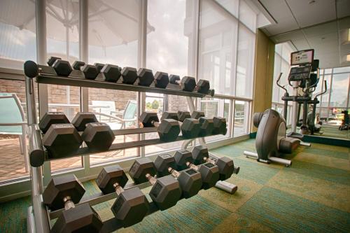 a gym with a bunch of chairs in a room at SpringHill Suites by Marriott Canton in North Canton