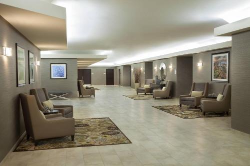 a waiting room with couches and chairs in a lobby at TownePlace Suites by Marriott Toronto Northeast/Markham in Markham