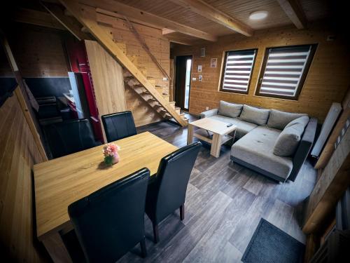 a living room with a table and a couch at TEVA Lipno in Lipno nad Vltavou