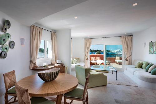 a living room with a couch and a table at Cervo Hotel,Costa Smeralda Resort in Porto Cervo