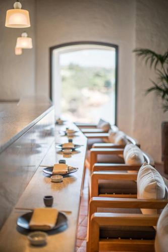 a row of chairs lined up in a row at Cervo Hotel,Costa Smeralda Resort in Porto Cervo