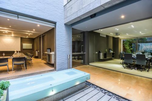 a large swimming pool in the middle of a house at BOG Hotel in Bogotá