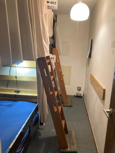 a room with two bunk beds in a room at Hostel Lodging Tokyo Ueno in Tokyo