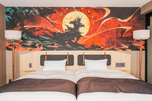 a bedroom with a bed with a painting on the wall at Kyoto Pleasant Hotel in Nishijin