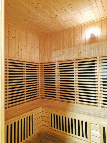 an empty sauna with wooden walls and wooden floors at Luxury Accommodation Trio Bukit Tinggi in Klang