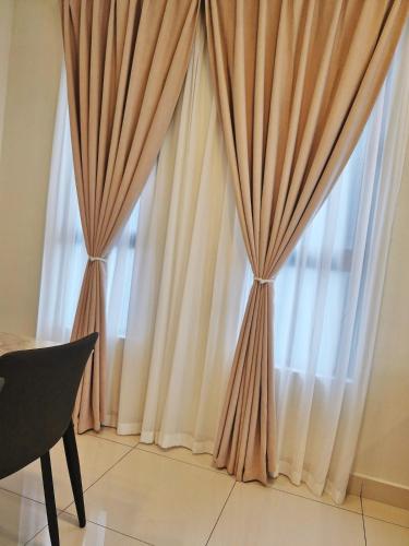a pair of curtains in front of a window at Luxury Accommodation Trio Bukit Tinggi in Klang