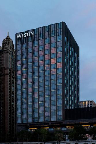 a building with the westin sign on top of it at The Westin Wuhan Wuchang in Wuhan