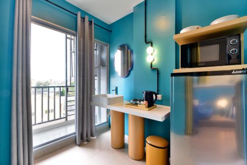 The Grass Serviced Suites tesisinde mutfak veya mini mutfak