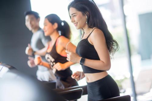 a group of people running in a gym at Cross Vibe Bangkok Sukhumvit in Bangkok