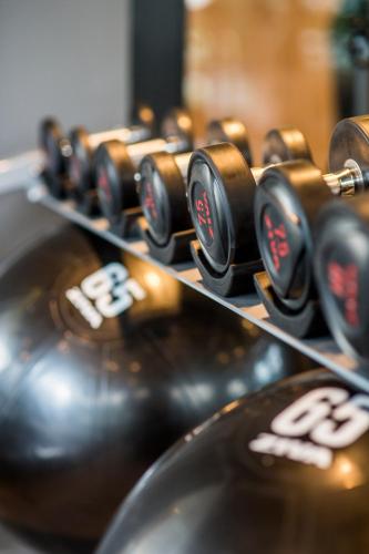 a row of brown clocks sitting on a machine at Cross Vibe Bangkok Sukhumvit in Bangkok