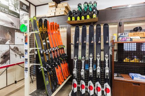 a bunch of skis are on display in a store at Hotel Jogakura in Aomori