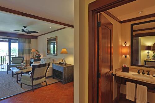 a bathroom with a living room and a room with a living room at JW Marriott Guanacaste Resort & Spa in Tamarindo