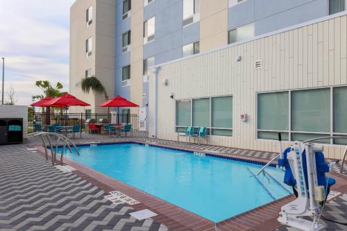 a large swimming pool in front of a building at TownePlace Suites by Marriott McAllen Edinburg in Edinburg