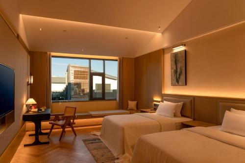 Postel nebo postele na pokoji v ubytování Papuman hotel