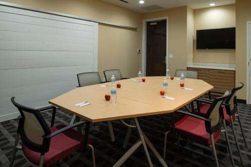 a conference room with a wooden table and chairs at TownePlace by Marriott Suites Clarksville in Clarksville