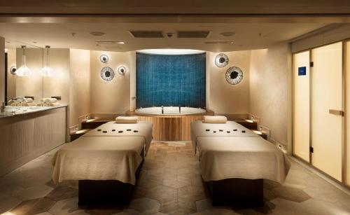 a treatment room with four beds and a window at Crowne Plaza Florya Istanbul by IHG in Istanbul