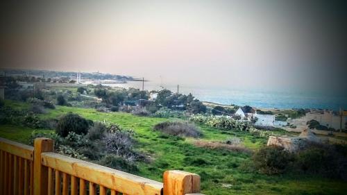 a view of the ocean from a balcony at Dimora Dei Gelsi in Polignano a Mare