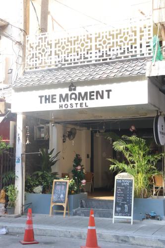 a restaurant with orange cones in front of it at The Moment Hostel in Bangkok