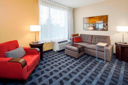 a living room with a couch and a chair at TownePlace Suites by Marriott Bellingham in Bellingham