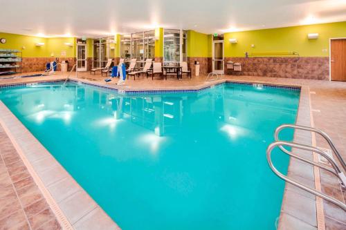 a large pool with blue water in a hotel at TownePlace Suites by Marriott Bellingham in Bellingham