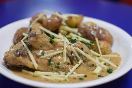a white plate of food with meat and pasta at Best Western Plus Le Conquerant Rouen Nord in Bois-Guillaume