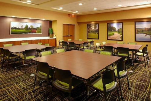 a conference room with tables and chairs in it at SpringHill Suites by Marriott Pittsburgh Latrobe in Latrobe