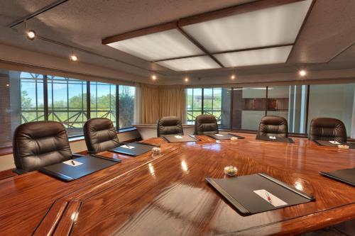 a conference room with a large wooden table and chairs at Salt Lake City Marriott University Park in Salt Lake City
