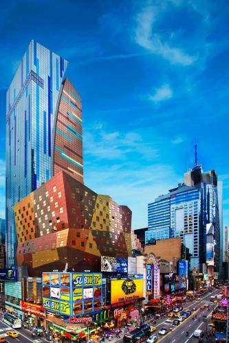 a busy city street with traffic in front of tall buildings at The Westin New York at Times Square in New York