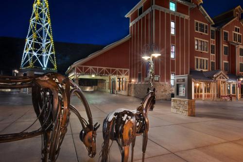 a metal sculpture of a horse in front of a building at Marriott's Summit Watch in Park City