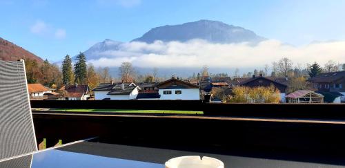 a view of a town with a mountain in the background at Alpenotel Rosenhof Ruhpolding, Wellness, Chiemgau Karte, Travelingo Bonus Programm in Ruhpolding