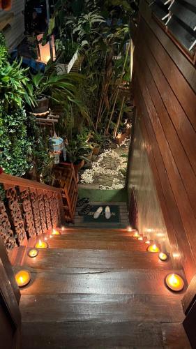 a garden with lights on a wooden walkway at Preanhuan Homestay in Mae On