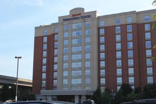 a large building with a sign on top of it at SpringHill Suites by Marriott Pittsburgh North Shore in Pittsburgh