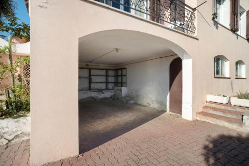 an entrance to a building with a balcony at Villa In Collina Vista Mare in Sanremo