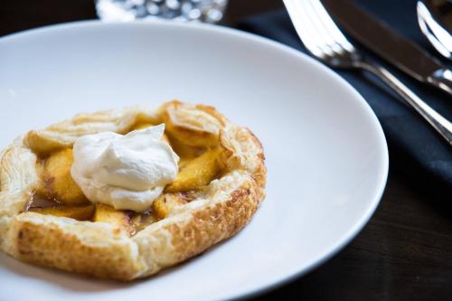 a waffle with ice cream on a white plate at Marriott St. Louis Grand in Saint Louis