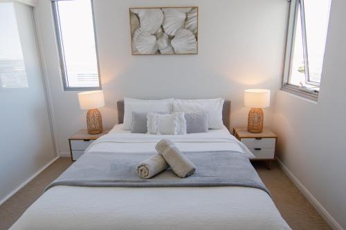 Ένα ή περισσότερα κρεβάτια σε δωμάτιο στο Nova Apartment Mooloolaba Beach