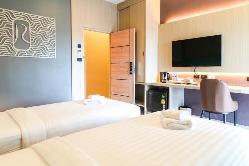Katil atau katil-katil dalam bilik di River Hotel Hatyai