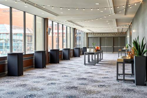 a lobby with a row of desks and windows at The Westin Edmonton in Edmonton
