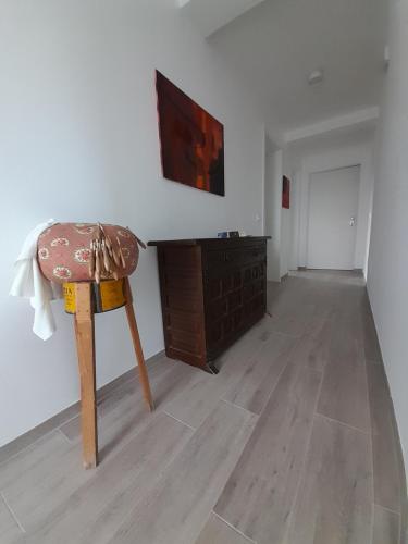 an empty room with a chair and a dresser at Alchemilla Bed & Breakfast in Offida