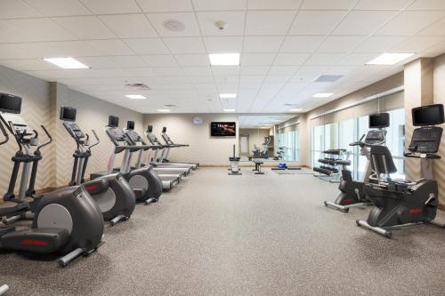 a fitness room with treadmills and cardio machines at SpringHill Suites by Marriott San Jose Airport in San Jose