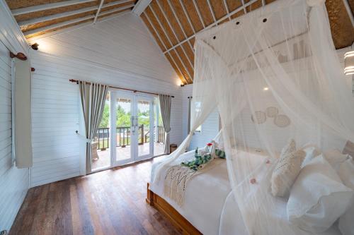 Postel nebo postele na pokoji v ubytování The Cubang Hut's Lembongan