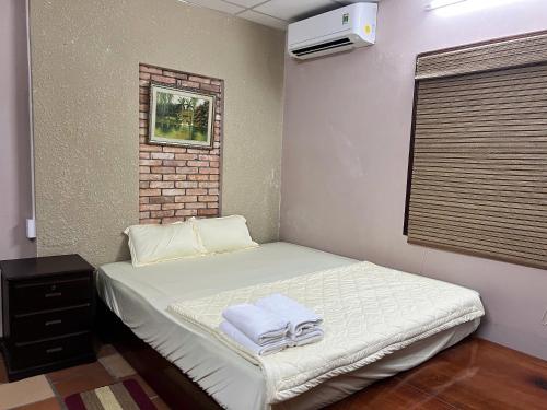 Postel nebo postele na pokoji v ubytování Biệt thự Tứ Quý