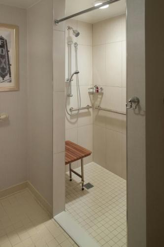 a shower in a bathroom with a wooden table at Atlanta Marriott Suites Midtown in Atlanta