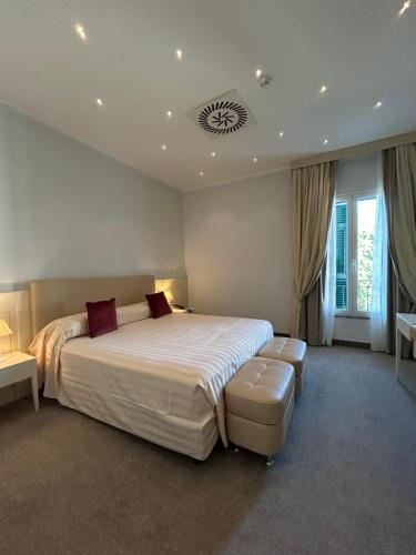 a large bedroom with a large bed and a window at Santa Caterina Park Hotel in Sarzana